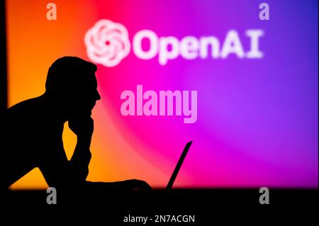 UK, LONDON. JANUARY 30, 2023: Open AI. Unleashing the Power of the Internet: Silhouetted Man Uses Innovative App to Browse Stock Photo
