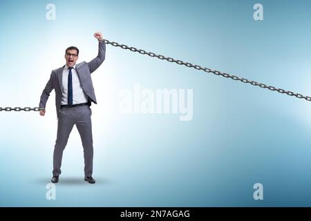 Chained businessman in the workaholic concept Stock Photo