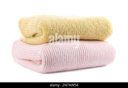 Stack of warm sweaters isolated on white Stock Photo