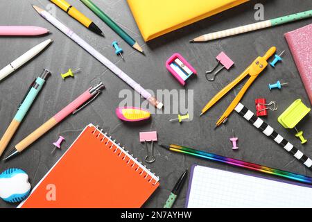 Flat lay composition with school stationeries on grey background Stock Photo