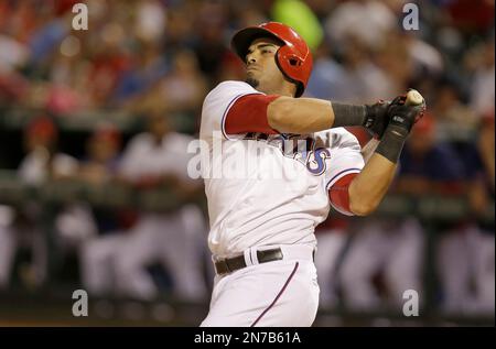 Texas Rangers' Nelson Cruz swings on a home run as Seattle