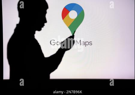 JAPAN, TOKYO. JANUARY 30, 2023: Google Map. Unleashing the Power of the Internet: Silhouetted Man Uses Innovative App to Browse Stock Photo