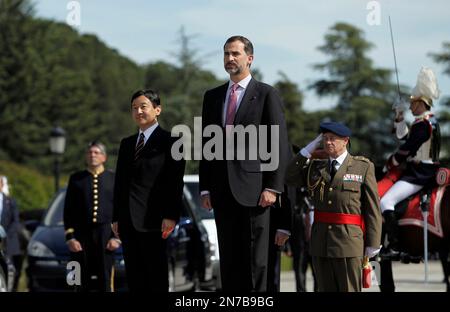 Spain's Crown Prince Felipe,centre and Japan's Crown Prince Naruhito, left, listen to the National anthems, during the welcome ceremony, at the Pardo Palace, near Madrid, Monday, June 10, 2013. Crown Prince Naruhito launched a celebration of Japan's 400-year relationship with Spain on a visit that will take him to a curious town where many residents still carry the name 'Japon' to honor the Japanese who visited in the 17th century. (AP Photo/Andres Kudacki)