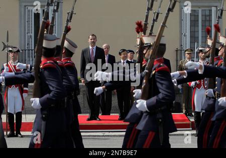 Spain's Crown Prince Felipe, centre left, and Japan's Crown Prince Naruhito, as they review royal guard troops during the welcome ceremony, at the Pardo Palace, near Madrid, Monday, June 10, 2013. Crown Prince Naruhito launched a celebration of Japan's 400-year relationship with Spain on a visit that will take him to a curious town where many residents still carry the name 'Japon' to honor the Japanese who visited in the 17th century. (AP Photo/Andres Kudacki)