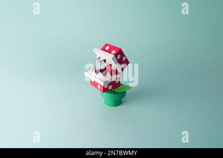 Papercraft of an isolated piranha plant model with mouth open from a classic nintendo video game Stock Photo