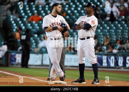 Houston Astros first base coach Jose Cruz checks his hair as he comes off  the field in the third inning against the St. Louis Cardinals at Busch  Stadium in St. Louis on