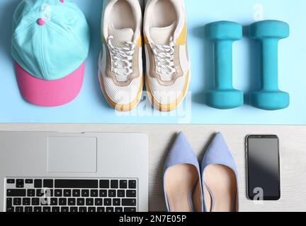 Flat lay composition with business items and sport accessories on color background. Concept of balance between work and life Stock Photo