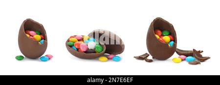 Set of broken chocolate eggs with colorful candies on white background, banner design Stock Photo