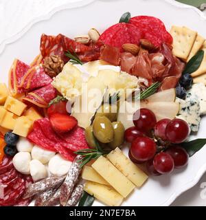 Plate full of tasty assorted appetizers, closeup Stock Photo