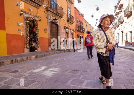 San Miguel de Allende Guanajuato Mexico,Historico Central historic center Zona Centro,cobblestone hanging stars Christmas decorations,woman women lady Stock Photo