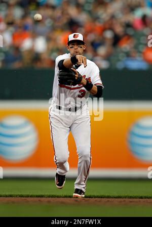 Baltimore Orioles second baseman Ryan Flaherty loses his glove