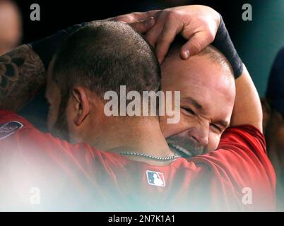 Boston Red Sox's Jonny Gomes (L) congratulates Mike Napoli after