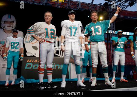 Miami Dolphins quarterback Ryan Tannehill (17) stands on a stage as the Miami  Dolphins unveil their new uniforms during an NFL football draft party,  Thursday, April 25, 2013 in Miami. Also shown