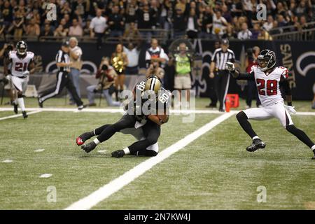 FILE - New Orleans Saints tight end Juwan Johnson (83) attempts to block Cleveland  Browns defensive end Myles Garrett (95) during an NFL football game,  Saturday, Dec. 24, 2022, in Cleveland. As