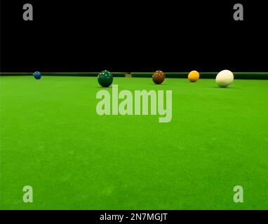 Billiard table close up. Playing billiard. Billiards balls and cue on green billiards table. Billiard sport concept. Pool billiard game Stock Photo
