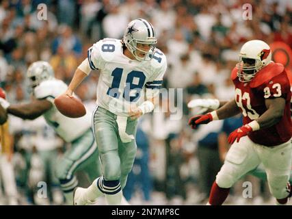 Dallas Cowboys quarterback Bernie Kosar scrambles under the pressure of  Phoenix Cardinals defensive lineman Reuben Davis (93) in the third quarter,  Nov. 14, 1993 in Irving, Texas. (AP Photo/Eric Gay Stock Photo - Alamy