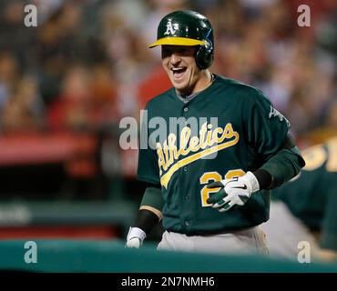Oakland Athletics' Josh Donaldson reacts while batting while Seattle  Mariners catcher Mike Zunino picks up the ball during a baseball game in  Seattle on Saturday, Sept. 28, 2013. (AP Photo/John Froschauer Stock