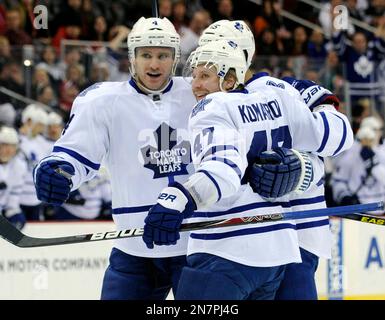 Toronto Maple Leafs Leo Komarov 47 celebrates his goal with Cody Franson left and Mark Fraser during the first period of an NHL hockey game against the New Jersey Devils Saturday April