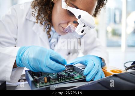 Computer hardware, programming and black woman electrician working on cpu, circuit and microchip. IT maintenance, technology repair and engineer with Stock Photo