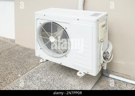 outdoor unit of split air conditioner for cooling, hanging on the wall Stock Photo