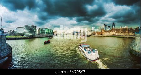 Threatening storm clouds over the River Thames and the City of London, seen from Tower Bridge Stock Photo