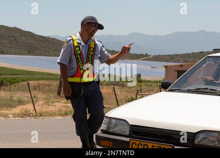 Western Cape, South Africa, 2023 SAPS South African police officer on a roadside drivers licence and insurance check Stock Photo