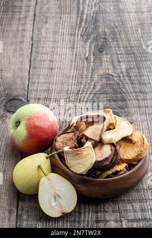 Dried  fruits in wooden bowl on wooden table Stock Photo
