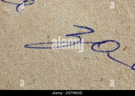 illegible handwritten font written in pen on old paper in Russian as background macro photo Stock Photo