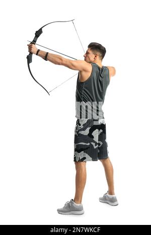 Man with bow and arrow practicing archery on white background Stock Photo