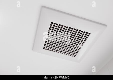 Toilet air ventilator.Bathroom fan air flow grill for room deodorizing and dehumidifying. Stock Photo