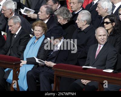 Italian President Giorgio Napolitano, bottom row at center, sits beside his wife Clio and President of the Italian Senate Pietro Grasso, left as they attend Pope Francis' installation Mass, in St. Peter's Square at the Vatican, Tuesday, March 19, 2013. From right in the second row is Lower Chamber of Parliament President Laura Boldrini, Italian Premier Mario Monti, and his wife Elsa. (AP Photo/Riccardo De Luca)