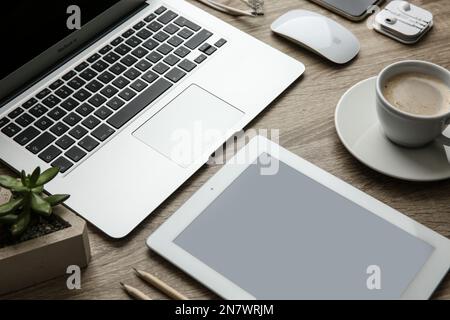 MYKOLAIV, UKRAINE - JULY 20, 2020: Composition with iPhone 11 and different Apple gadgets on wooden table Stock Photo