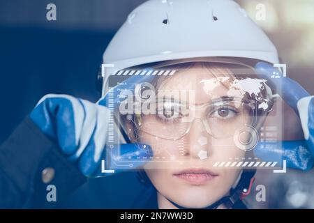 closeup engineer looking digital holographic interface digital system for modern industry concept Stock Photo