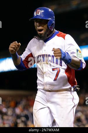 Dominican Republic's Jose Reyes, left, celebrates with teammate Nelson Cruz  their 9-0 victory over Panama at a World Baseball Classic game in San Juan,  Sunday, March 8, 2009. (AP Photo/Fernando Llano Stock