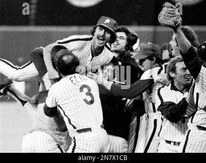 In this Oct. 21, 1980 file photo, Philadelphia Phillies pitcher Tug McGraw  leaps into the air as Kansas City Royals batter Willie Wilson strikes out  to end the game and give the Phillies the World Series in the ninth inning,  in Philadelphia. In the bac