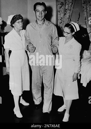 First baseman of the Philadelphia Phillies Eddie Waitkus and Carol Webel of  Albany leave the altar of St. Patrick's Church in Albany, N.Y., Nov. 17,  1951, after their wedding ceremony. (AP Photo