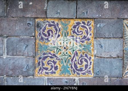 Tile in the wall of Southbank House/ China Works the old Royal Doulton factory in Lambeth Stock Photo