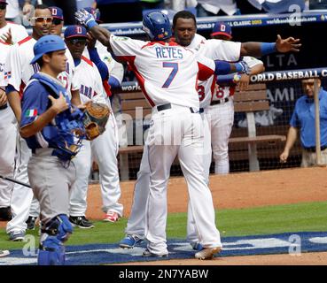 Dominican Republic's Jose Reyes, left, celebrates with teammate Nelson Cruz  their 9-0 victory over Panama at a World Baseball Classic game in San Juan,  Sunday, March 8, 2009. (AP Photo/Fernando Llano Stock