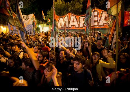 Supporters of Venezuela's President Hugo Chavez rally outside the Supreme  Court with a flag of Argentine revolutionary leader Ernesto Che Guevara  in Caracas, Venezuela, Thursday, Oct. 27, 2005, where the court is