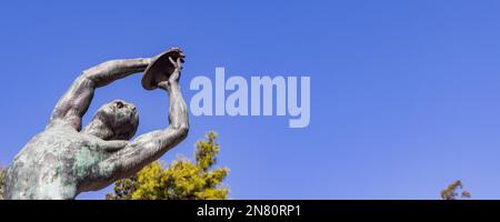 Athens, Greece - September 25, 2021: Bronze discobolus sculpture atlete in front of he Panathenaic Stadium or Kallimarmaro in Athens in Greece Stock Photo