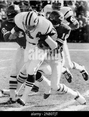 New York Jets' John Riggins is tackled by Now England Patriots