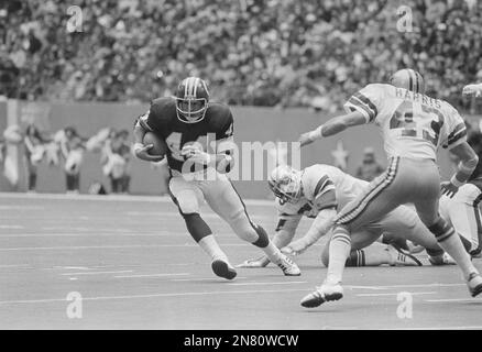 Washington Redskins' full back John Riggins (44) is slowed down near the  Dallas goal line by Cowboys cornerback Benny Barnes, left, and linebacker  Bob Breunig (53) during the frist quarter of game