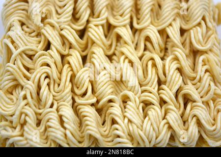 Quick cooking product, food, vermicelli, thin noodles in dry form is located on a white background. Stock Photo