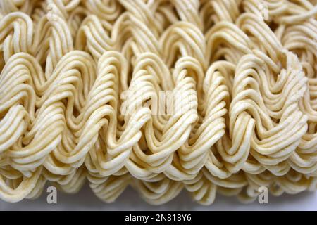 Quick cooking product, food, vermicelli, thin noodles in dry form is located on a white background. Stock Photo