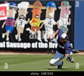 The ball hit by Milwaukee Brewers' Prince Fielder gets by Pittsburgh  Pirates first baseman Ryan Doumit in the first inning of the first game of  a scheduled double header baseball game in