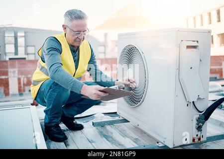 Engineer on rooftop, air conditioning and technician with clipboard, maintenance or repair machine. Male, worker or handyman with document, checklist Stock Photo
