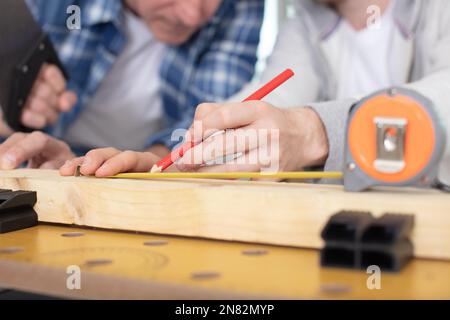 carpenter with pencil and folding rule Stock Photo