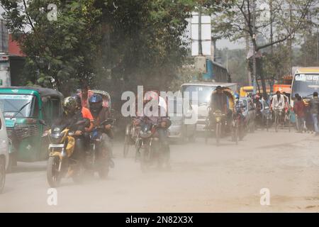 Dhaka, Bangladesh - February 11, 2023: There is so much dust on the Mugda road in Dhaka, Bangladesh. Dhaka city has been at the top of air pollution n Stock Photo