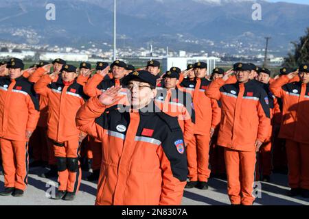 Antakya, Turkey. 10th Feb, 2023. Members of the China Search and Rescue Team attend a flag-raising ceremony at their camp in Antakya in the southern province of Hatay, Turkey, Feb. 10, 2023. China has offered an array of rescue teams and vital items to Turkey and Syria since massive earthquakes and aftershocks jolted the countries on Monday, in an effort to help search for survivors trapped under the rubble. Credit: Shadati/Xinhua/Alamy Live News Stock Photo