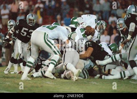 Philadelphia Eagles quarterback Randall Cunningham dives from the 1-yard  line to score and give Eagles 33-27 overtime victory over the Los Angeles  Raiders at the Coliseum in Los Angeles on Nov. 30, 1986. Raiders No. 75 is  Howie Long. (AP Photo/Bob